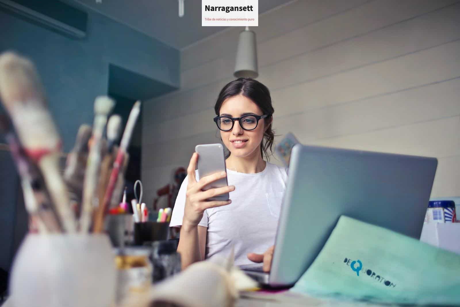 woman in white shirt using smartphone