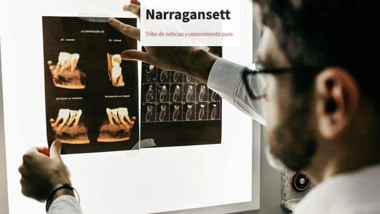 person in gray long sleeve shirt holding black tablet computer