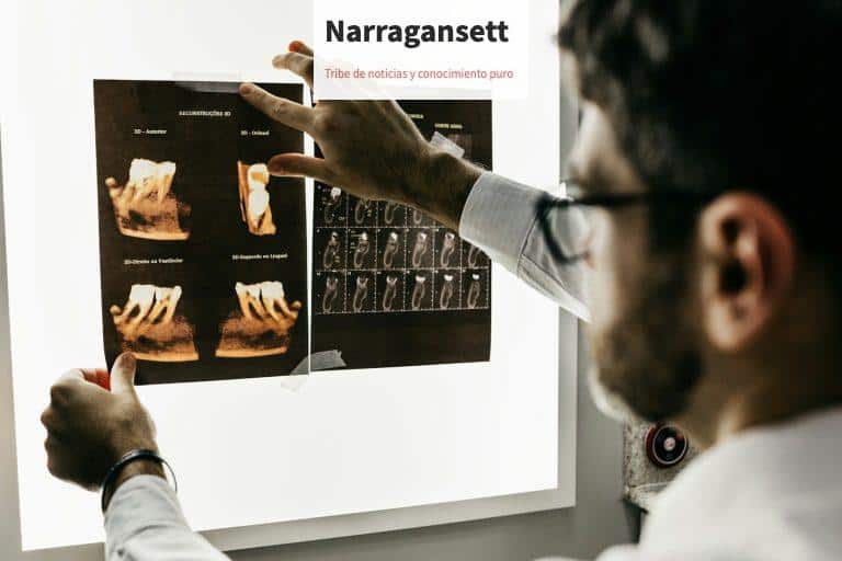 person in gray long sleeve shirt holding black tablet computer