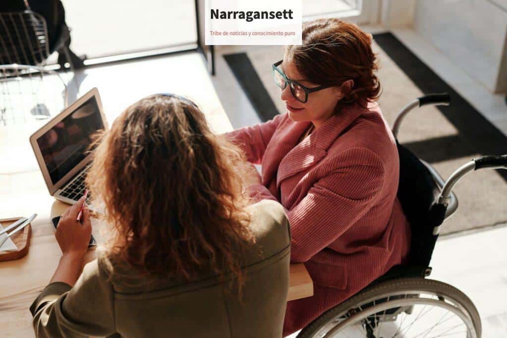 Woman in Red Sweater Wearing Black Framed Eyeglasses Sitting on Wheelchair