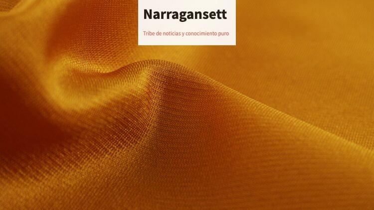 Close-up of a smooth, golden silk fabric showcasing its luxurious texture and shine.