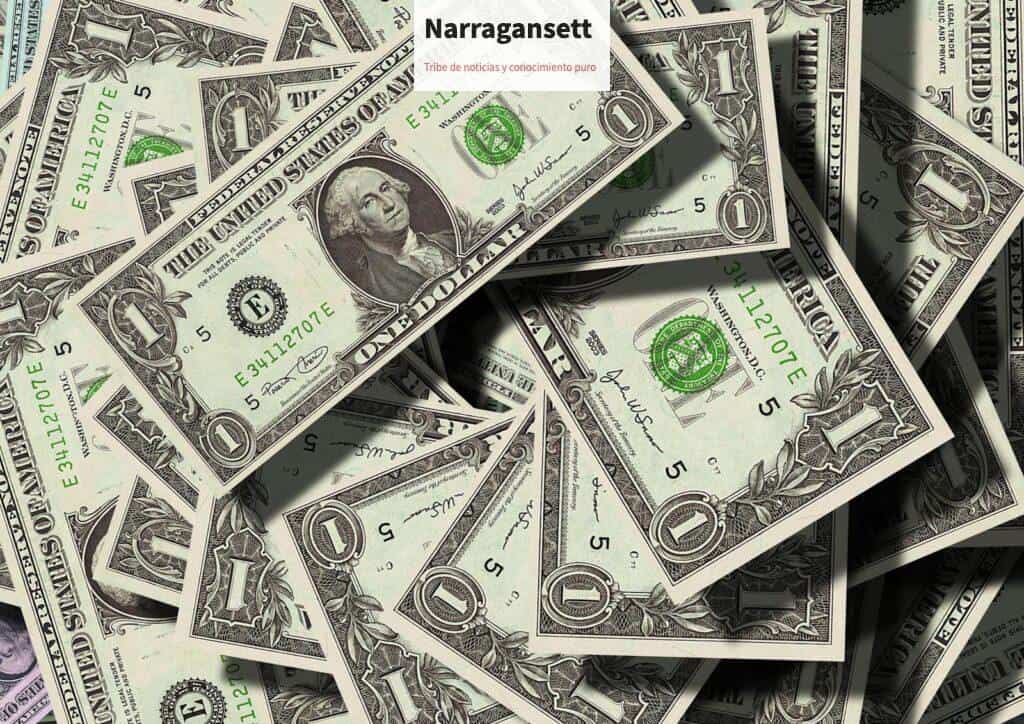 Close-up of scattered US dollar bills symbolizing finance and wealth.