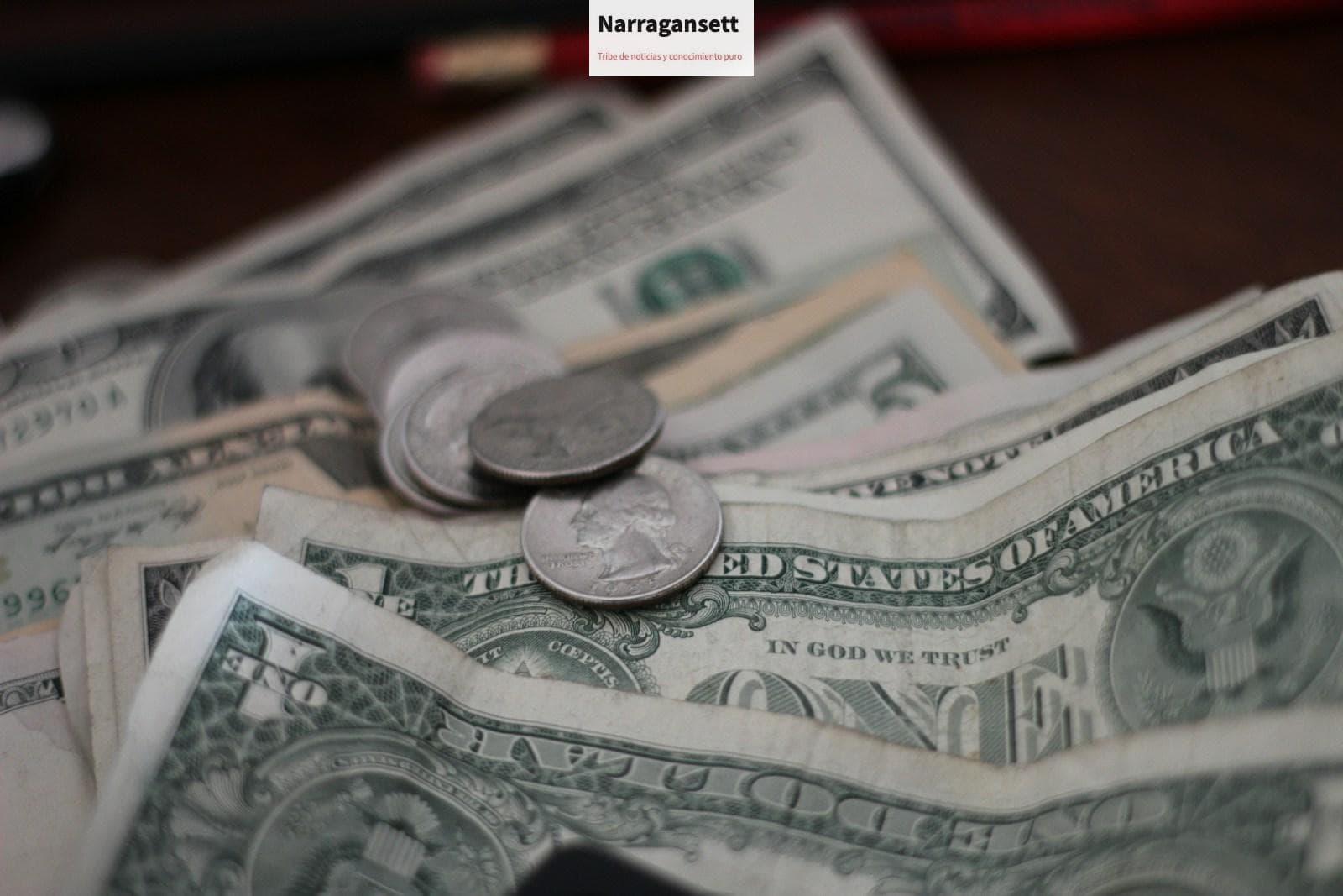 photo of dollar coins and banknotes