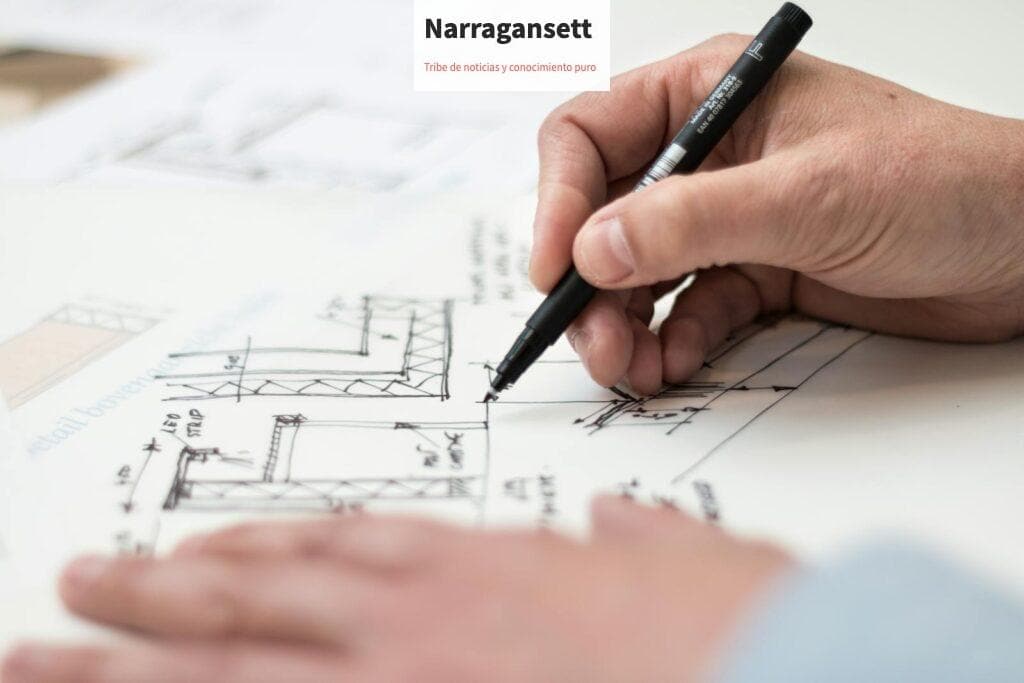 Close-up of hand drawing intricate technical designs on blueprint with pen, ideal for engineering or architecture themes.